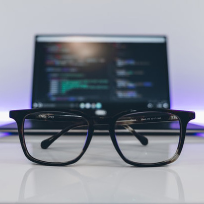 Glasses In Front Of A Monitor With Coding-Content