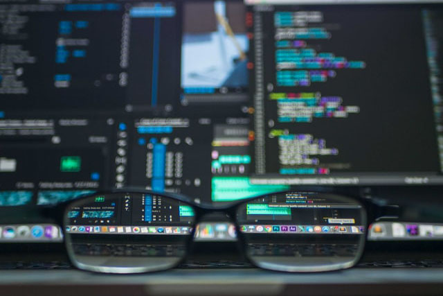 Glasses In Front Of A Monitor