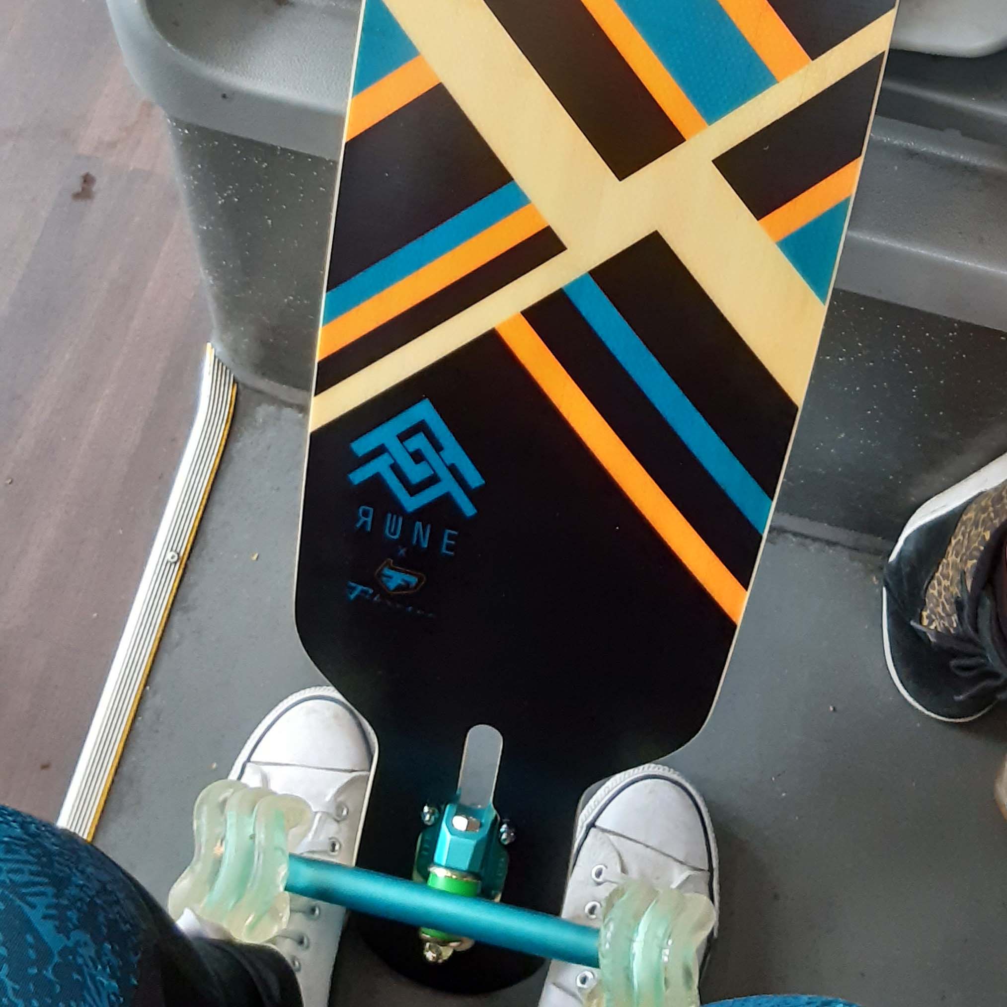 Longboard With Black Orange And Blue Strypes