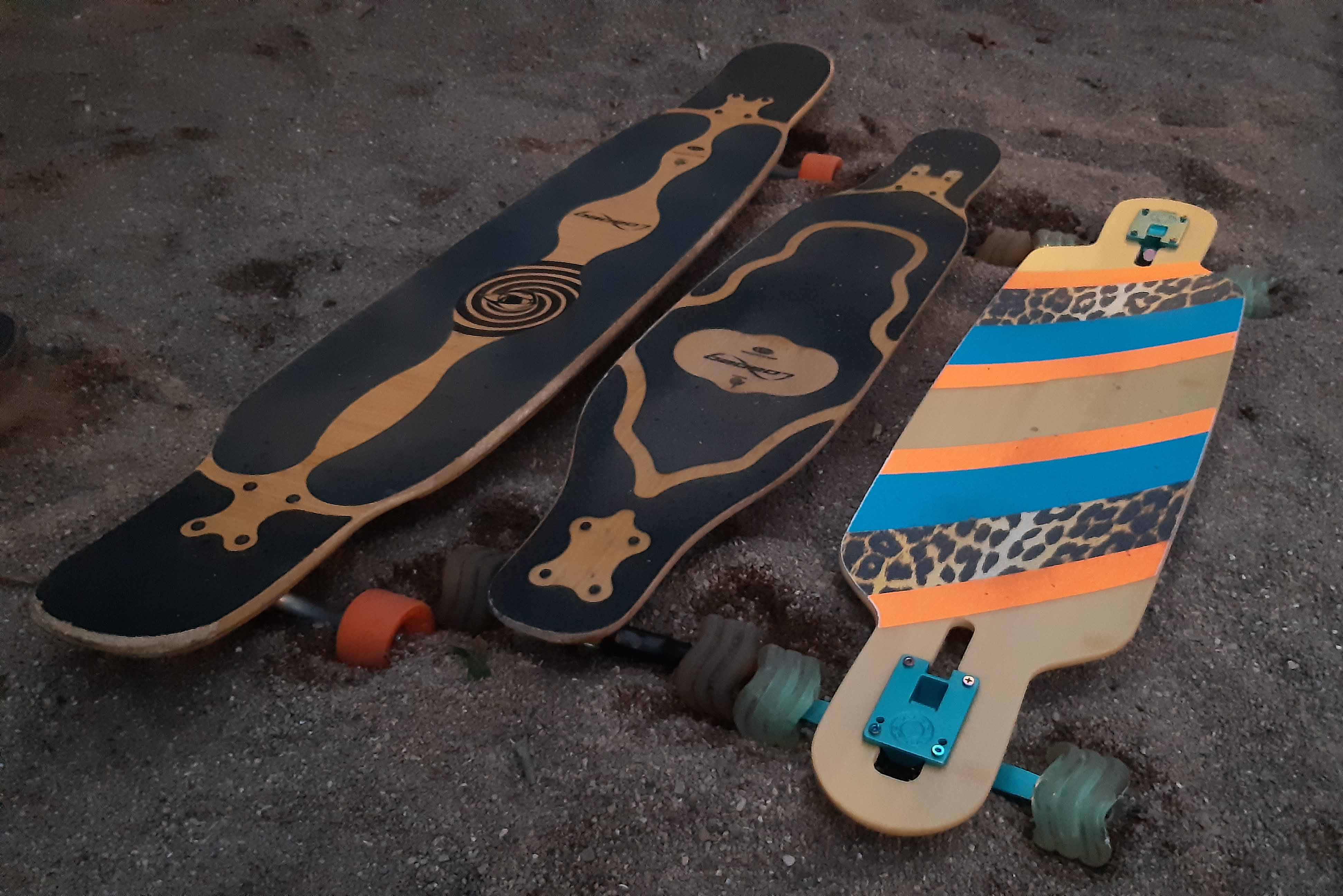 Three Longboards In The Sand